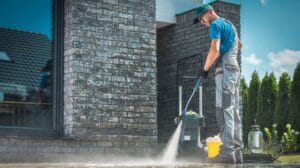 pressure washer cleaning in front of the house