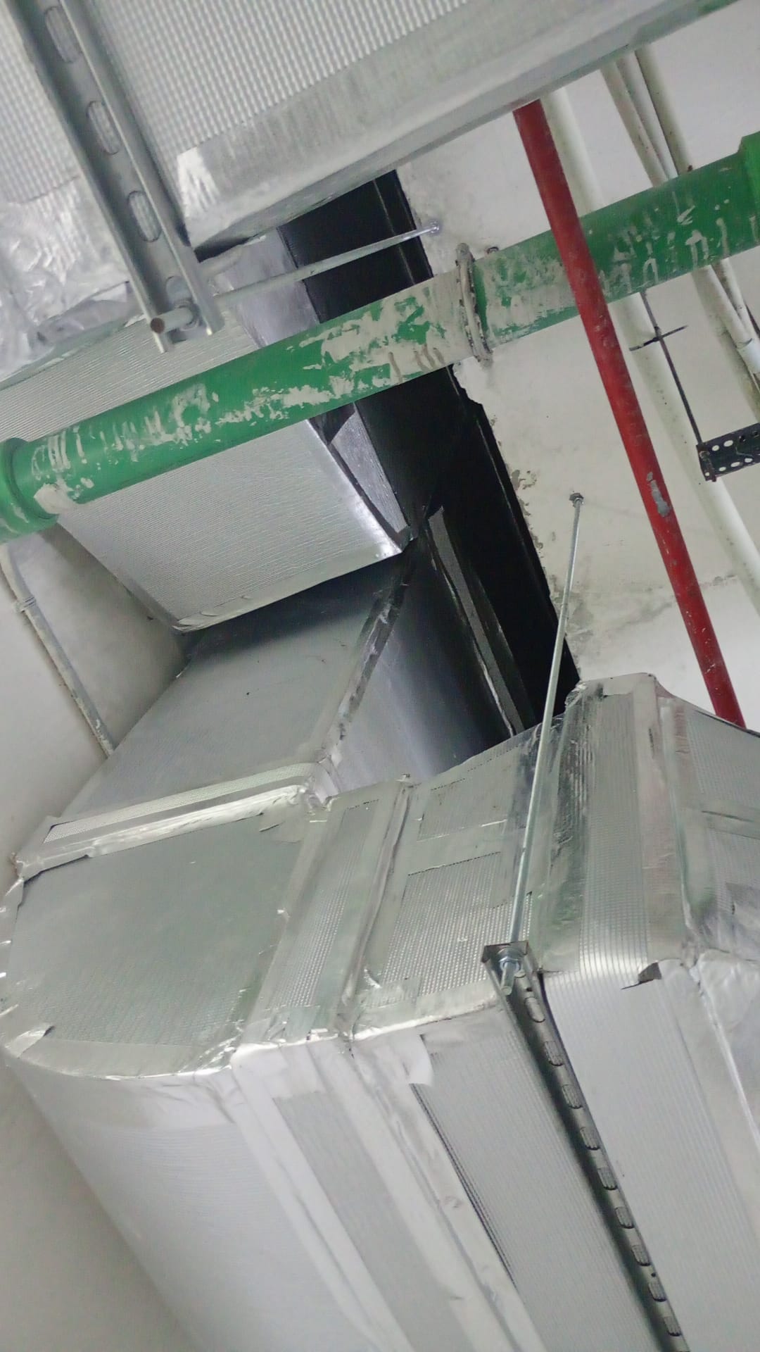 Ductwork and insulation above a ceiling void