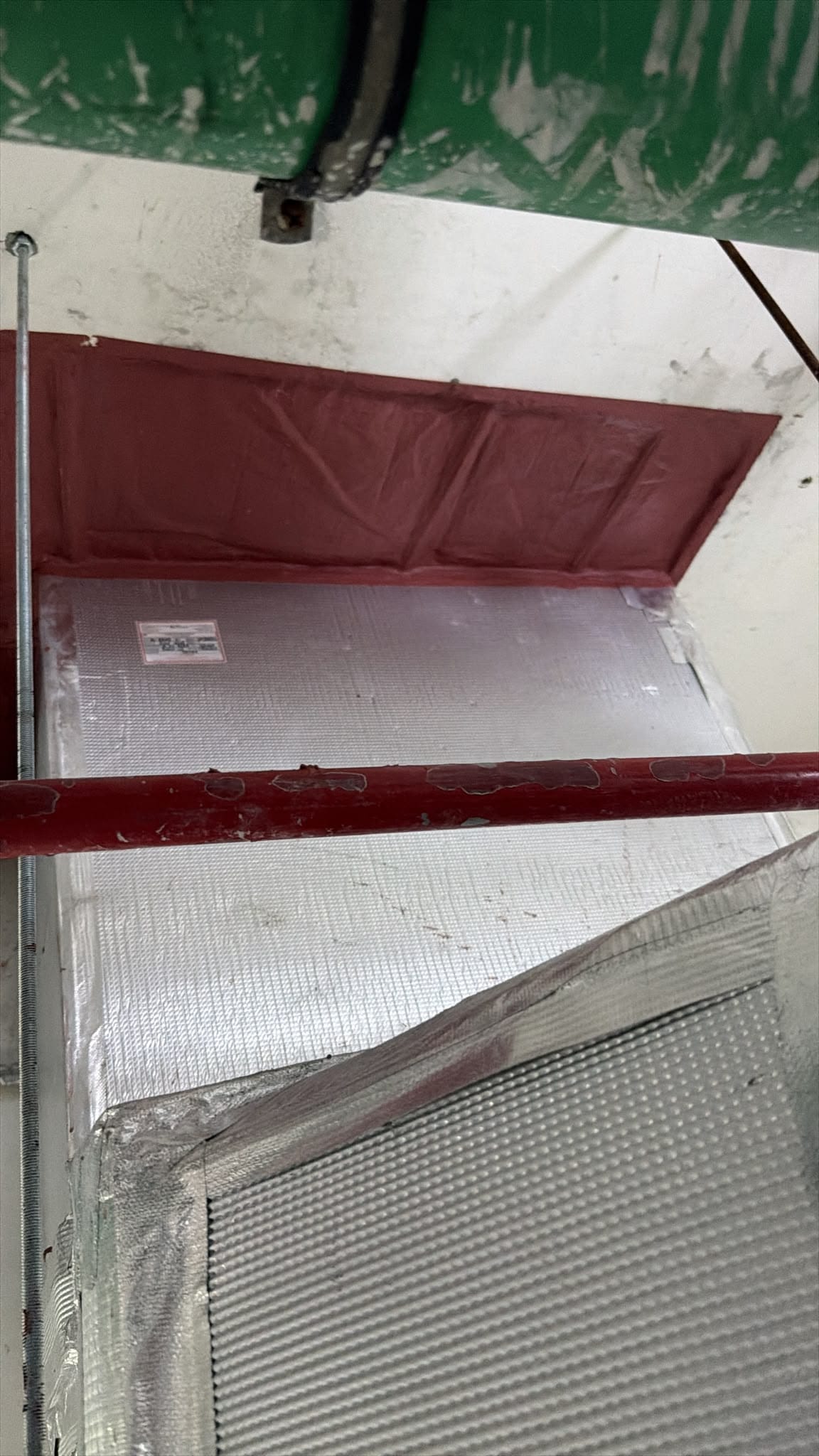 Ductwork and insulation above a ceiling void
