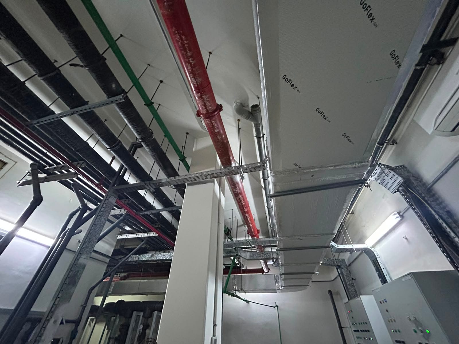 Ductwork and insulation above a ceiling void